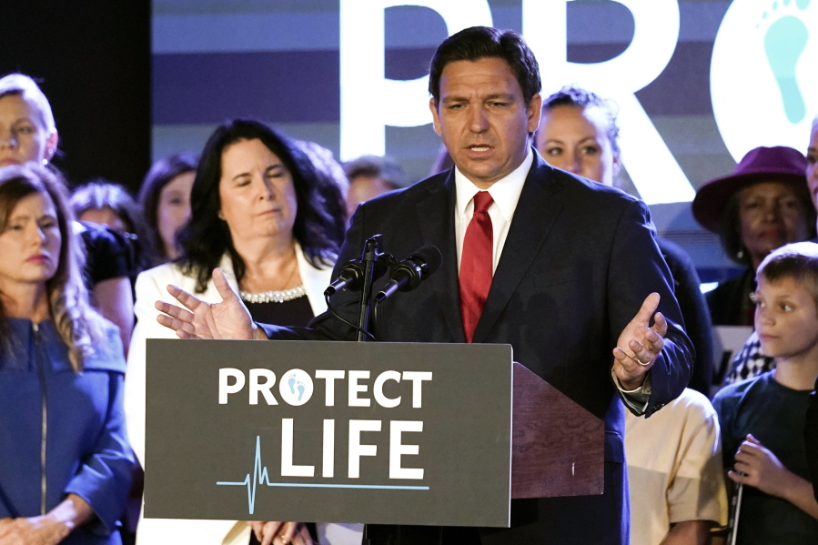 Florida Gov. Ron DeSantis speaks to supporters before signing a 15-week abortion ban into law Thursday, April 14, 2022, in Kissimmee, Fla. The move comes amid a growing conservative push to restrict abortion ahead of a U.S. Supreme Court decision that could limit access to the procedure nationwide.