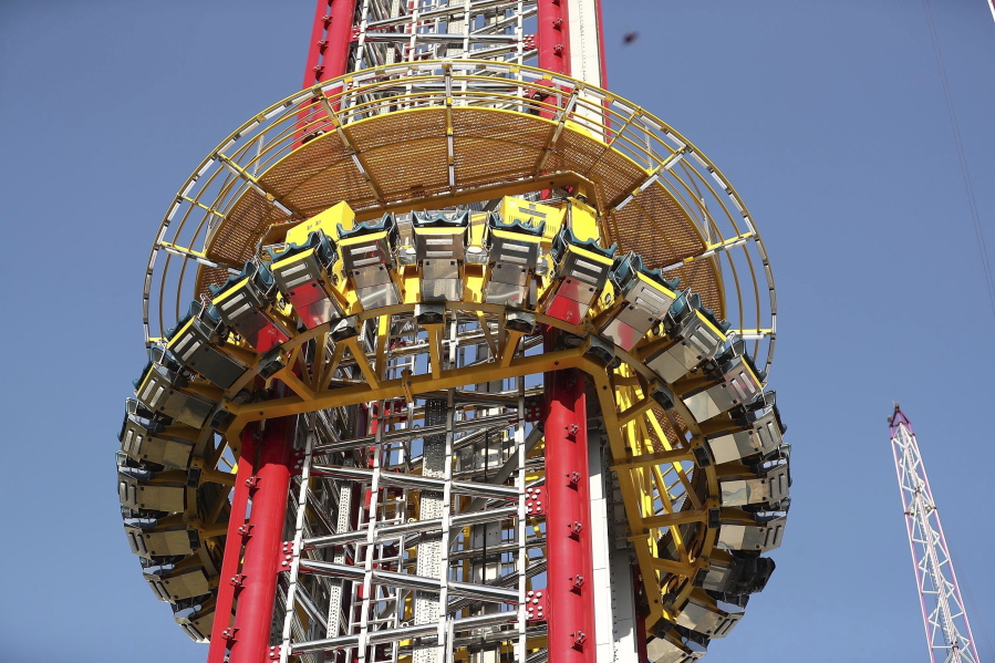FILE - The Orlando Free Fall drop tower in ICON Park in Orlando is pictured on Monday, March 28, 2022.  The parents of a 14-year-old boy who fell to his death from a 430-foot drop-tower ride in central Florida's tourist district have sued its owner, manufacturer and landlord, claiming they were negligent and failed to provide a safe amusement ride. The lawsuit was filed Monday, April 25, 2022, in state court in Orlando.   (Stephen M.