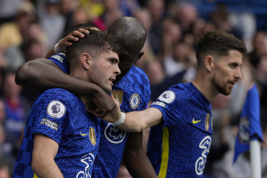 Chelsea's Christian Pulisic, left, celebrates with teammates after scoring the only goal of the game during the English Premier League soccer match between Chelsea and West Ham United at Stamford Bridge in London, Sunday, April 24, 2022. Chelsea won the match 1-0.
