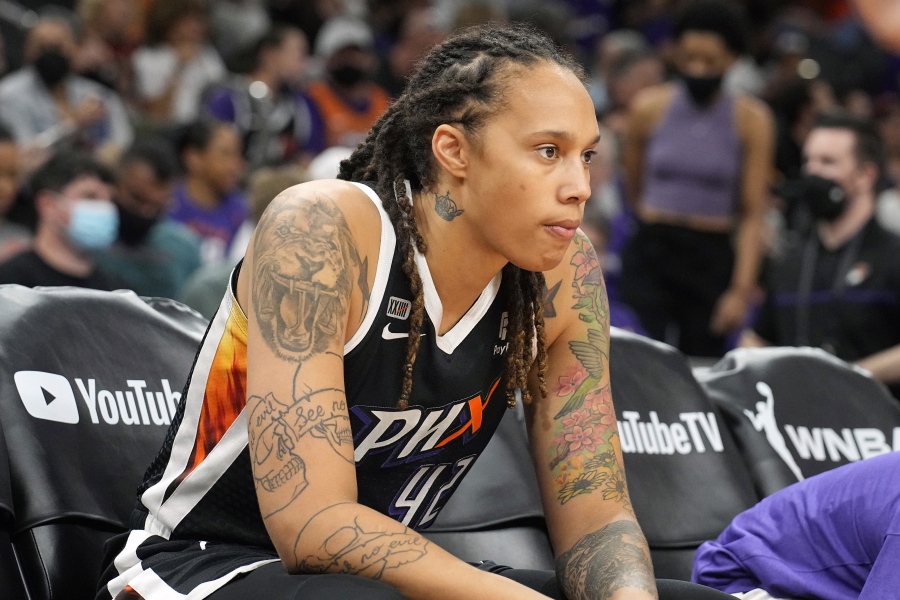 FILE - Phoenix Mercury center Brittney Griner sits during the first half of Game 2 of basketball's WNBA Finals against the Chicago Sky, Wednesday, Oct. 13, 2021, in Phoenix. Griner is easily the most prominent American citizen known to be jailed by a foreign government. Yet as a crucial hearing approaches next month, the case against her remains shrouded in mystery, with little clarity from the Russian prosecutors.