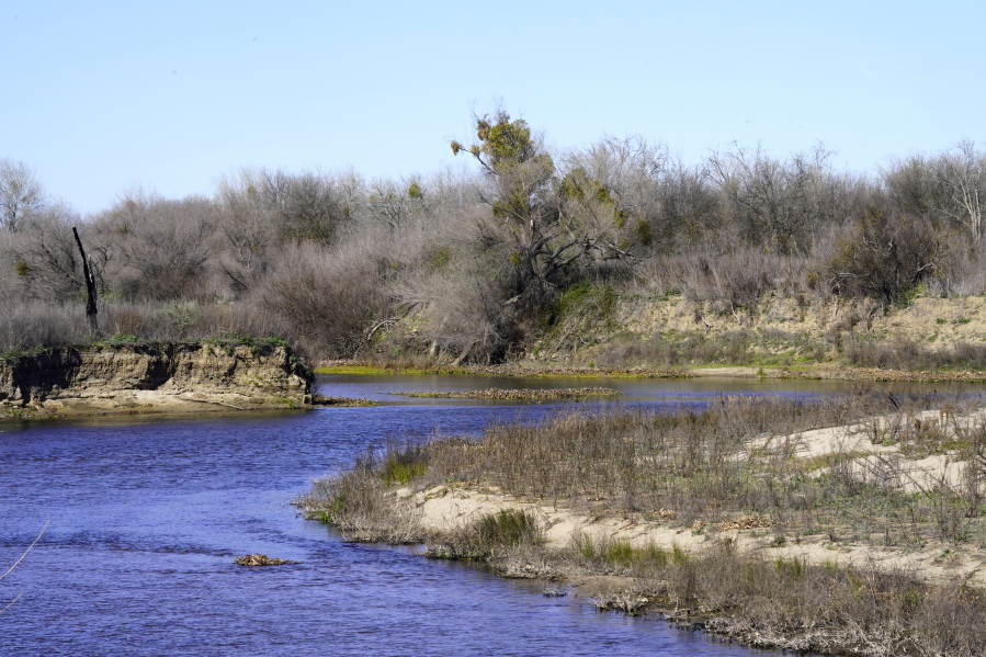 The Tuolumne and San Joaquin rivers meet on the edge of the Dos Rios Ranch Preserve in Modesto, Calif., Wednesday, Feb. 16, 2022. The 2,100-acre preserve is California's largest floodplain restoration project, designed to give the rivers room to breath and restore traditional riparian habitats.