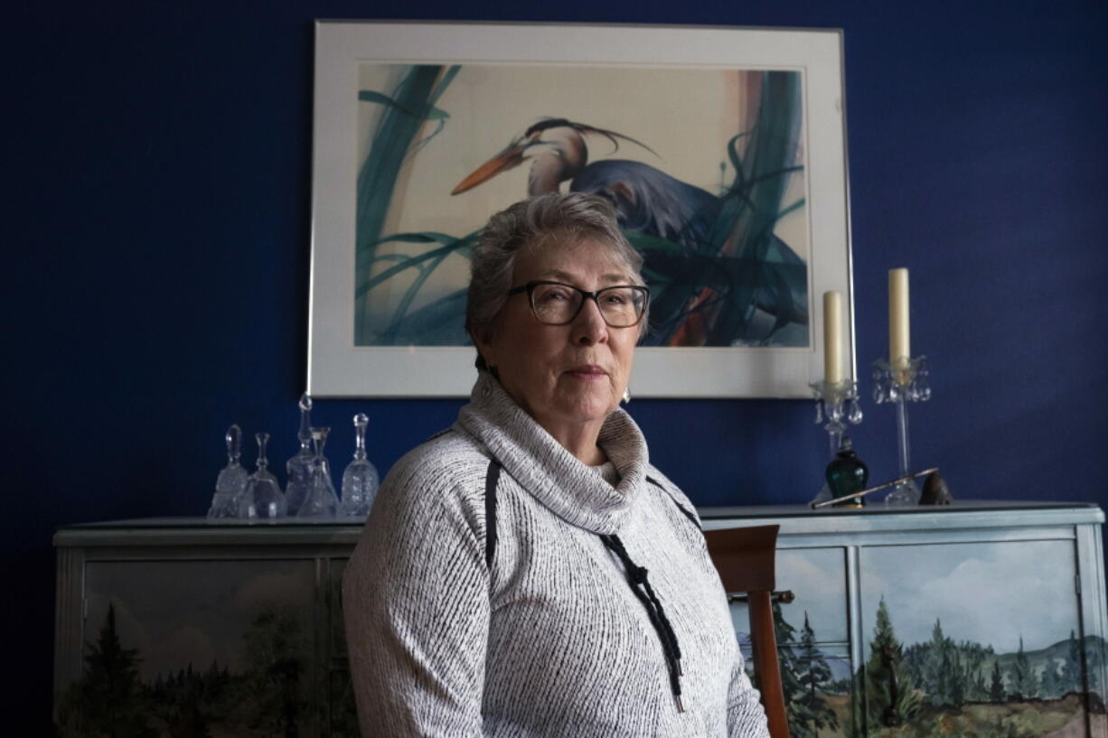 Joyce Ares sits for a portrait in the dinning room of her home March 18 in Canby, Ore.