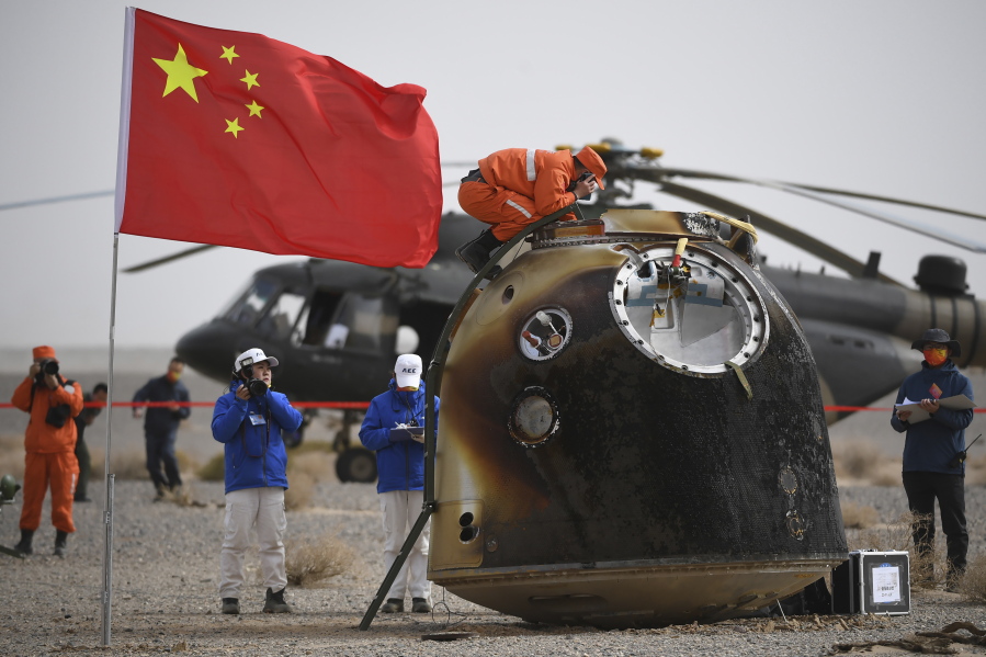 In this photo released by China's Xinhua News Agency, the return capsule of the Shenzhou-13 manned space mission is seen after landing at the Dongfeng landing site in northern China's Inner Mongolia Autonomous Region, Saturday, April 16, 2022. Three Chinese astronauts returned to Earth on Saturday after six months aboard China's newest space station in the longest crewed mission to date for its ambitious space program.