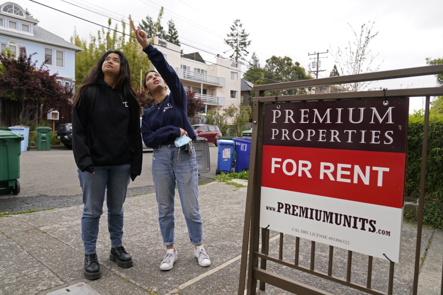 University of California, Berkeley freshmen Sanaa Sodhi, right, and Cheryl Tugade look for apartments in Berkeley, Calif., Tuesday, March 29, 2022. Millions of college students in the U.S. are trying to find an affordable place to live as rents surge nationally, affecting seniors, young families and students alike. Sodhi is looking for an apartment to rent with three friends next fall, away from the dorms but still close to classes and activities on campus. They've budgeted at least $5,200 for a two-bedroom.
