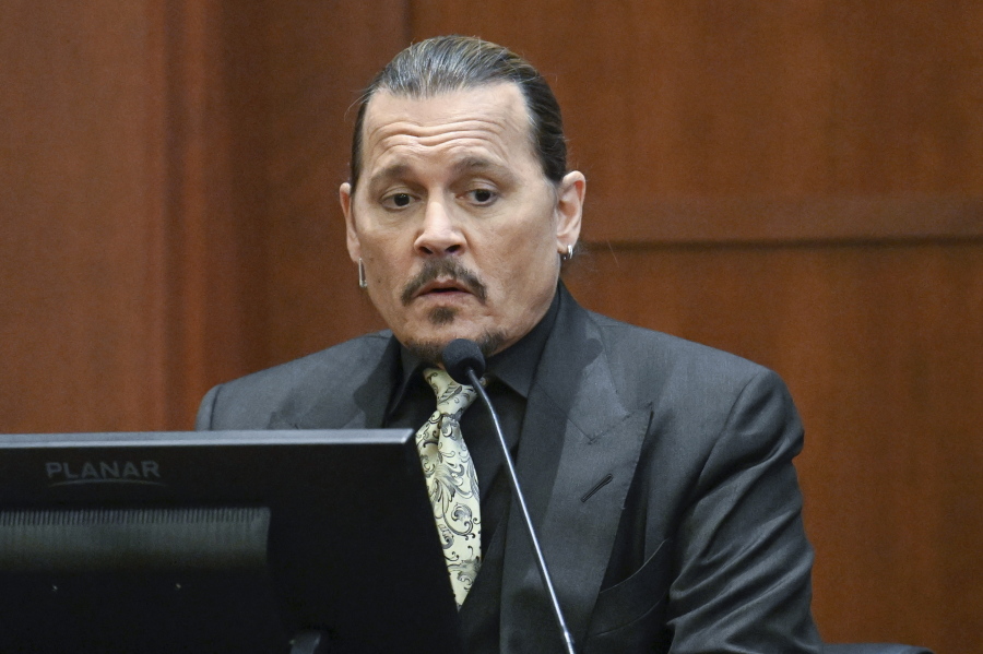 Actor Johnny Depp testifies during a hearing at the Fairfax County Circuit Court in Fairfax, Va., Tuesday April 19, 2022.