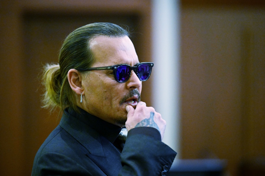 Actor Johnny Depp listens during a hearing at the Fairfax County Circuit Court in Fairfax, Va., Tuesday April 19, 2022.