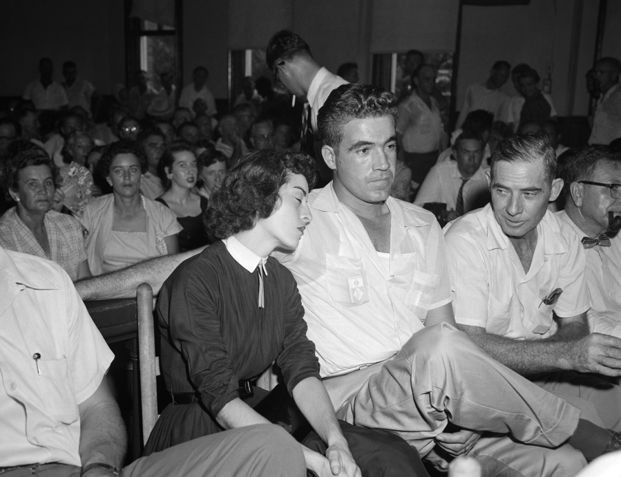 In this Sept. 22. 1955 photo, Carolyn Bryant rests her head on her husband Roy Bryant's shoulder after she testified in Emmett Till murder court case in Sumner, Miss. Stymied in their calls for a renewed investigation into the murder of Emmett Till, relatives and activists are advocating another possible path toward accountability in Mississippi: They want authorities to launch a kidnapping prosecution against the woman who set off the lynching by accusing the Chicago teen of improper advances in 1955.