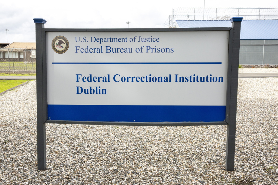 FILE - A sign for the Federal Correctional Institution Dublin is displayed on Jan. 9, 2019, in Dublin, Calif. A government watchdog has found a "substantial likelihood" the federal Bureau of Prisons committed wrongdoing when it ignored complaints and failed to address asbestos and mold contamination at the federal women's prison that has already been under scrutiny for rampant sexual abuse of inmates.