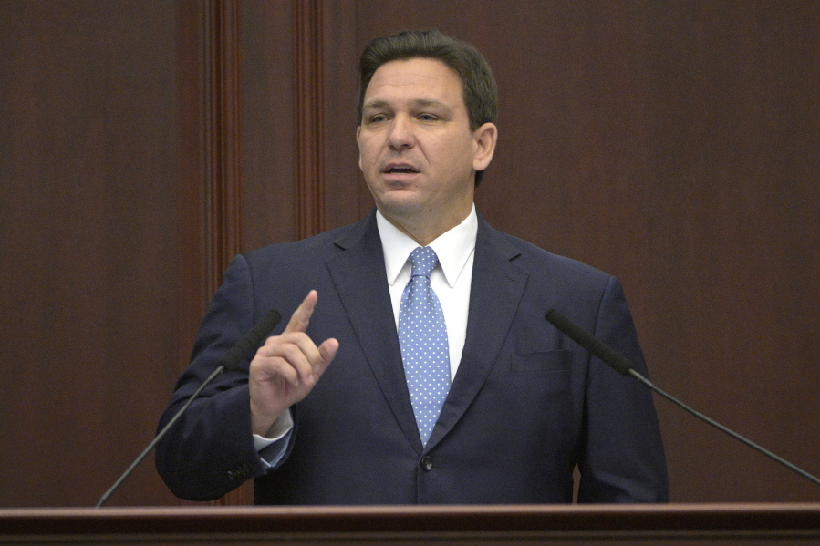 FILE - Florida Gov. Ron DeSantis addresses a joint session of a legislative session, Jan. 11, 2022, in Tallahassee, Fla.   (AP Photo/Phelan M.