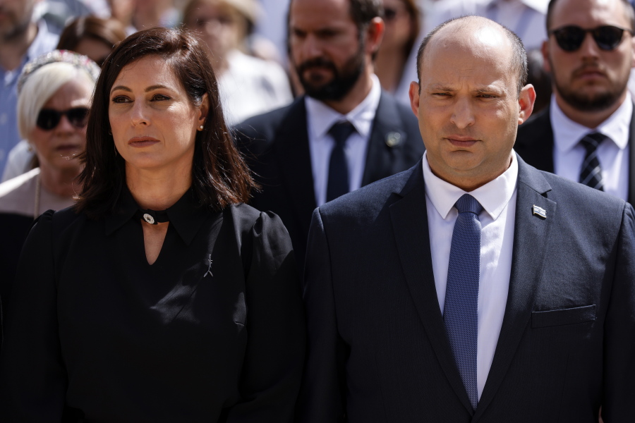 Israeli Prime Minister Naftali Bennett and his wife Gilat take part in the ceremony marking Holocaust Remembrance Day at Warsaw Ghetto Square at the Yad Vashem memorial in Jerusalem, Thursday, April 28, 2022.