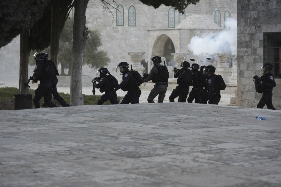 Israeli police clash with Palestinian protesters at the Al Aqsa Mosque compound in Jerusalem's Old City, Friday, April 22, 2022.
