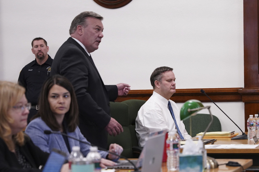 Chad Daybell listens to a motion by his defense attorney, John Prior, standing, to move his trial during a court hearing in St. Anthony, Idaho, Tuesday, April 19, 2022. Daybell's wife, Lori Daybell, a mother accused of conspiring in the murders of her two children and her new husband's late wife is scheduled to be arraigned in eastern Idaho on Tuesday.