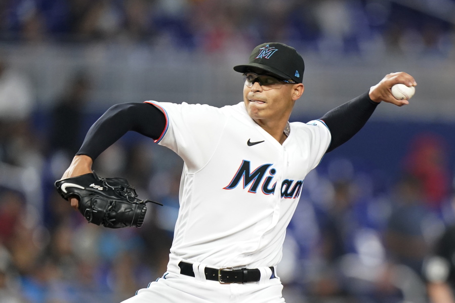 Miami Marlins' Jesus Luzardo delivers a pitch during the first inning of a baseball game against the Seattle Mariners, Saturday, April 30, 2022, in Miami.