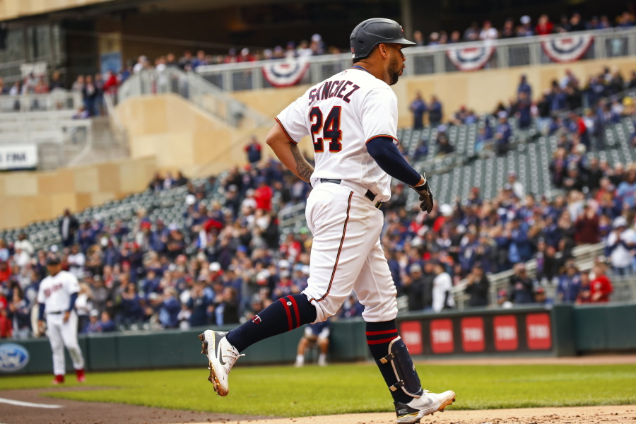 Minnesota Twins' Gary Sanchez (24) rounds to home base after hitting a grand slam against the Seattle Mariners during the first inning of a baseball game, Sunday, April 10, 2022, in Minneapolis.