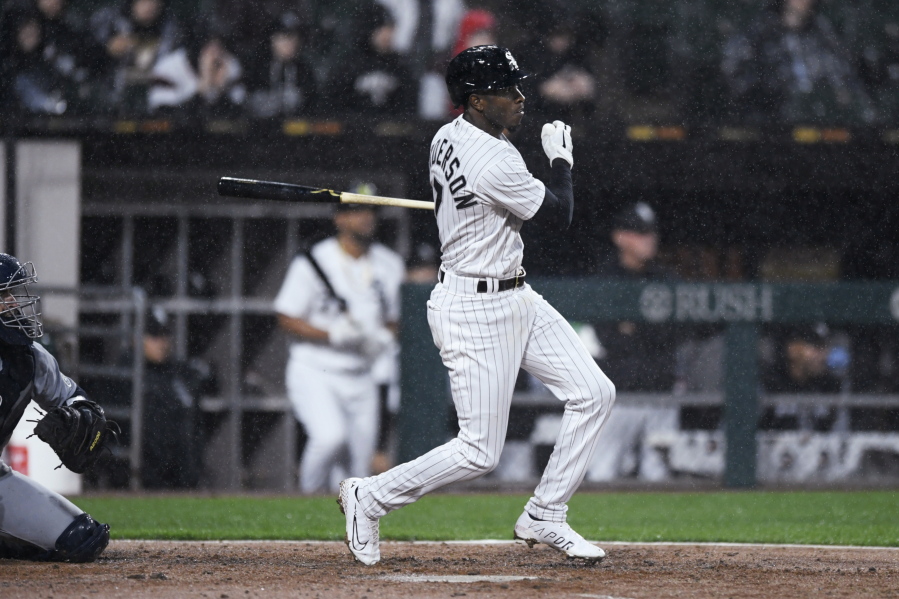 Chicago White Sox's Tim Anderson watches his two-run double during the second inning of the team's baseball game against the Seattle Mariners on Wednesday, April 13, 2022, in Chicago.