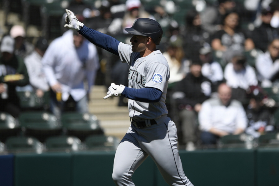 Seattle Mariners' Jarred Kelenic celebrates after hitting a two-run home run during the second inning of a baseball game against the Chicago White Sox Thursday, April 14, 2022, in Chicago.