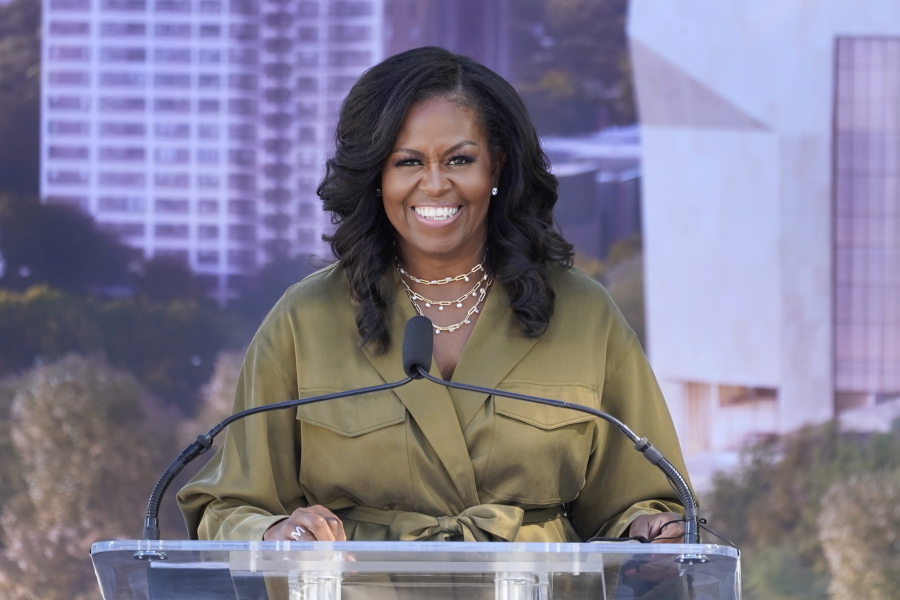 FILE - Former first lady Michelle Obamad smiles as she speaks during a groundbreaking ceremony for the Obama Presidential Center, Sept. 28, 2021, in Chicago. Michelle Obama will deliver the keynote address at a democracy summit sponsored by a national, nonpartisan voting organization she helped create, the group announced Wednesday, April 20, 2022.