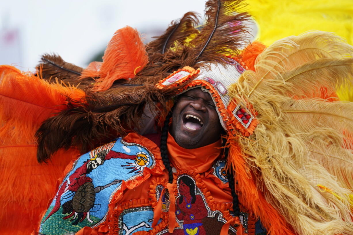 Big Chief Cantrell Watson, of the New Orleans Mardi Gras Indian tribe Wild Mohicans, chants as he parades through the New Orleans Jazz & Heritage Festival in New Orleans, Friday, April 29, 2022.