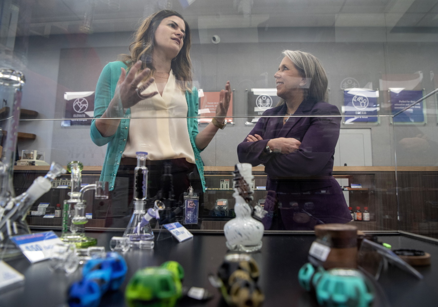 Gov. Michelle Lujan Grisham, right, takes a tour of the Everest Cannabis Co.-Uptown with CEO Trishelle Kirk on the first day of recreational cannabis sales, Friday April 1, 2022, Albuquerque.