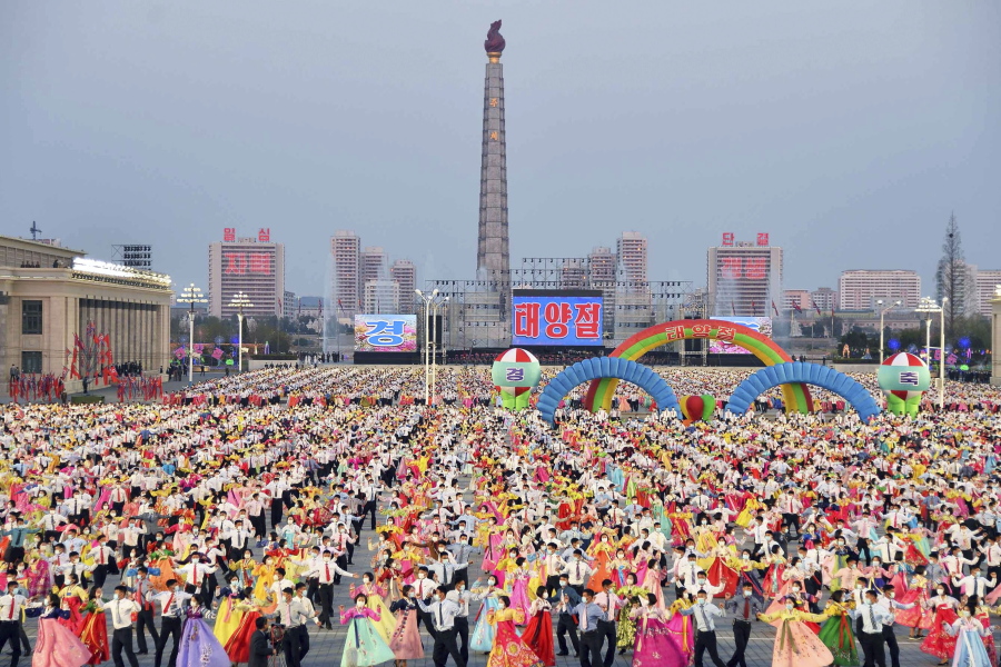 People dance in the celebration of the birth anniversary of late state founder Kim Il Sung, at the Kim Il Sung Square in Pyongyang, North Korea, Friday, April 15, 2022.