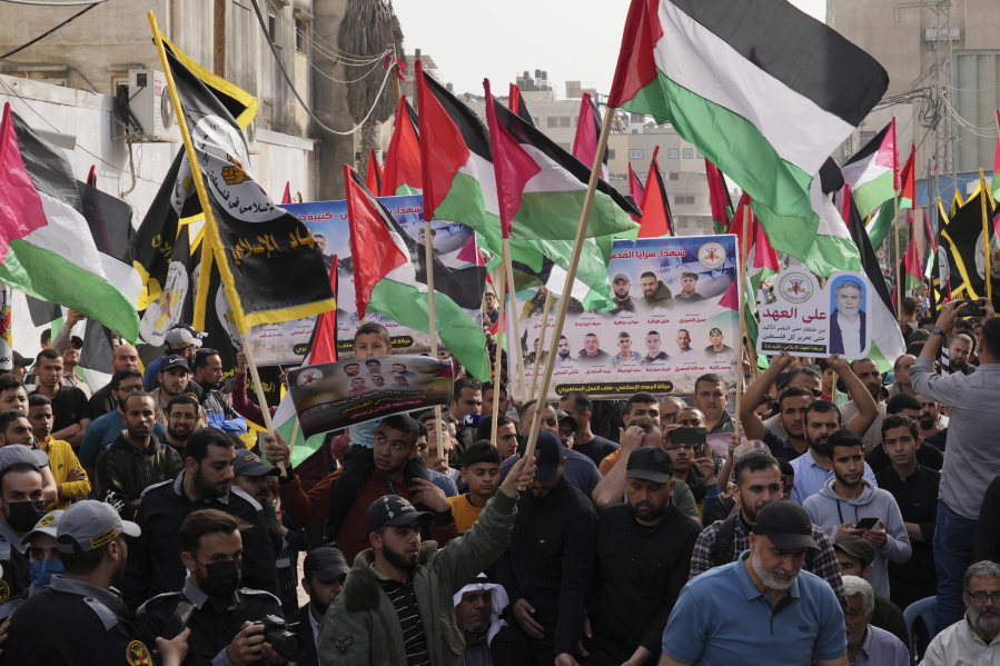 Islamic Jihad actives wave their national flags during a rally to mark Al-Quds, or Jerusalem, Day at the main road in Gaza City, Friday, April 29, 2022.