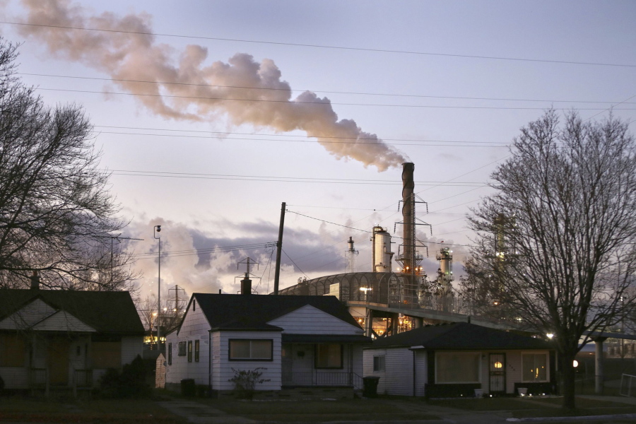 In an undated file photo, smoke billows from a Marathon Petroleum refinery near a neighborhood in southwest Detroit. One year after launching its Climate Funders Justice Pledge, The Donors of Color Network says it now has a $100 million funding baseline for environmental groups led by the minorities already disproportionately harmed by extreme weather events. The network also plans to announce Tuesday, April 5, 2022 that ClimateWorks Foundation will sign the full pledge, promising transparent reporting of their grants and to direct at least 30% of its climate funding grants to groups with Black, Indigenous or other people of color as their leaders.