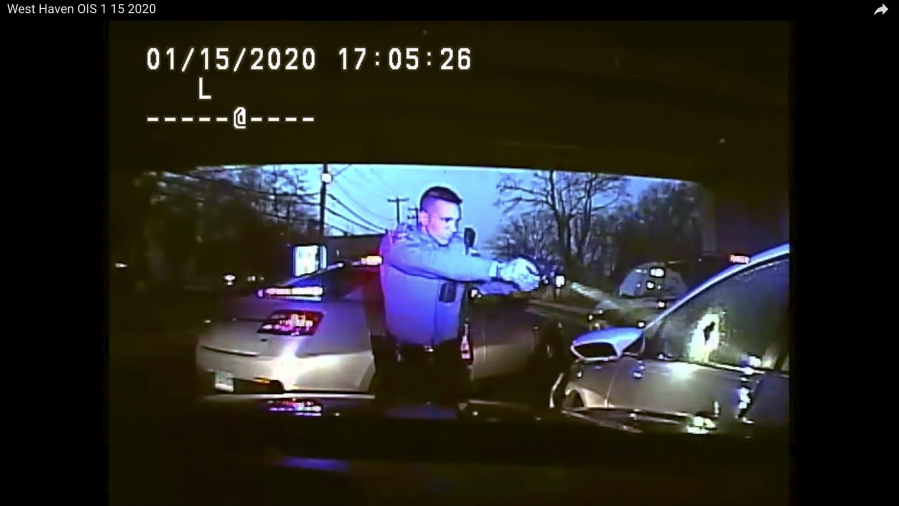 FILE - This Jan. 15, 2020, still image from dashboard camera video released by the Connecticut State Police shows Trooper Brian North after discharging his weapon and fatally shooting Mubarak Soulemane following a high-speed chase. North was arrested Tuesday night, April 19, 2022, in connection with the shooting, state police said.
