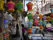 People shop for decorations for the Muslim holy month of Ramadan in Beirut, Lebanon, on April 2. Muslims throughout the world are marking Ramadan, a month of fasting during which observants abstain from food, drink and other pleasures from sunrise to sunset.