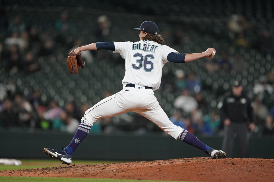 Seattle Mariners starting pitcher Logan Gilbert throws to a Texas Rangers batter during the seventh inning of a baseball game, Wednesday, April 20, 2022, in Seattle. The Mariners won 4-2. (AP Photo/Ted S.