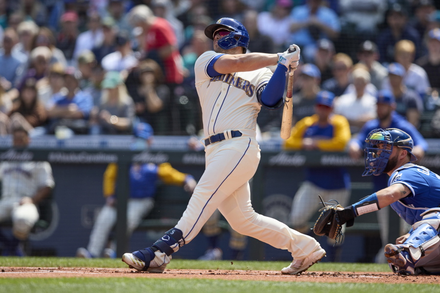 Seattle Mariners' Ty France hits a two-run home run on a pitch from Kansas City Royals starter Carlos Hernandez during the first inning of a baseball game, Sunday, April 24, 2022, in Seattle.