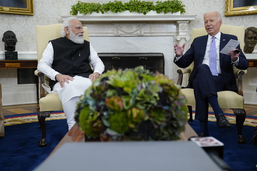 FILE - President Joe Biden meets with Indian Prime Minister Narendra Modi in the Oval Office of the White House, Sept. 24, 2021, in Washington. President Biden is set to speak with Indian Prime Minister Modi, Monday, April 11, 2022 when the two will virtually discuss the Ukraine war and other matters. India has earned Russian praise by maintaining a neutral stance in the war. India abstained when the U.N. General Assembly voted Thursday to suspend Russia from its seat on the 47-member Human Rights Council over allegations that Russian soldiers in Ukraine engaged in rights violations that the U.S. and Ukraine have called war crimes.
