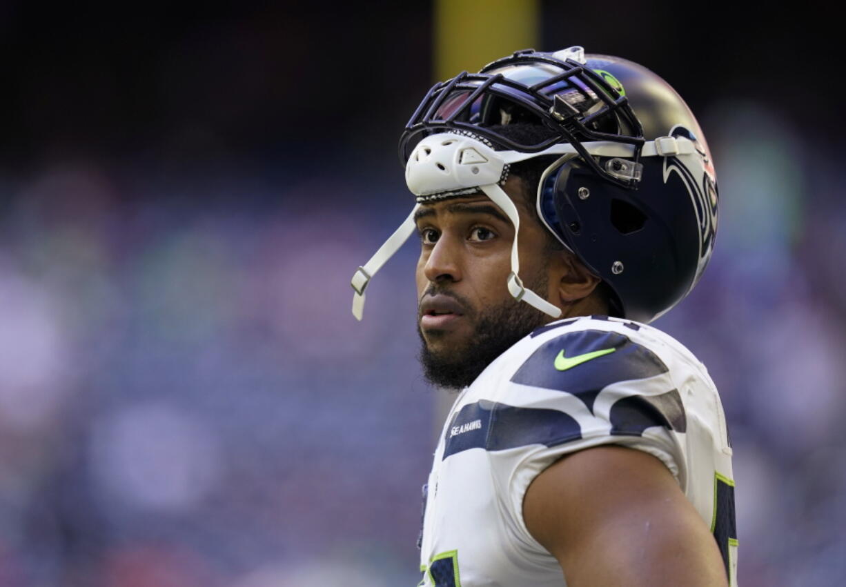 FILE - Seattle Seahawks linebacker Bobby Wagner pauses during the team's NFL football game against the Houston Texans on Dec. 12, 2021, in Houston. Wagner has been informed he is being released by Seattle. Wagner confirmed the news to The Associated Press on Tuesday night, March 8, 2022, hours after the team agreed to trade quarterback Russell Wilson to Denver. Seattle is expected to make Wagner's release official Wednesday.