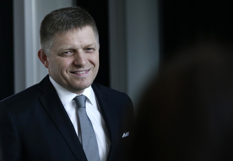 FILE - In this Sunday, March 6, 2016 file photo, Robert Fico, the then chairman of the SMER-Social Democracy, smiles after a TV debate after Slovakia's general elections in Bratislava, Slovakia. On Wednesday April 20, 2022, Slovakia's police said that former Prime Minister Robert Fico was under investigation, facing unspecified criminal charges. Police said in a brief statement Fico's former Interior Minister Robert Kalinak have been also charged in the same case. Police immediately didn't offer any more details.