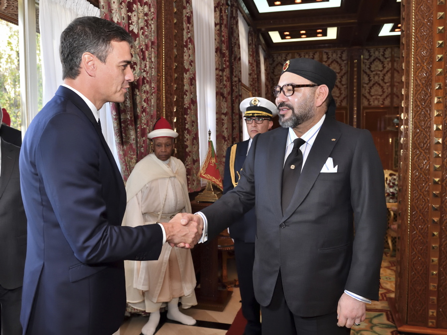 FILE - This photo provided by the Moroccan Royal Palace shows Spanish Prime Minister Pedro Sanchez, left, greeted by Moroccan King Mohammed VI prior to their lunch at the Royal Palace in Rabat, Morocco, Nov. 19, 2018. Sanchez is set to meet with Moroccan King Mohammed VI on Thursday, April 7, 2022 during a two-day visit to Rabat that promises to mark a mending of diplomatic tensions centered on the disputed region of Western Sahara. Relations were damaged last April when Morocco was angered by Spain allowing the leader of the pro-independence movement for Western Sahara to receive medical treatment.