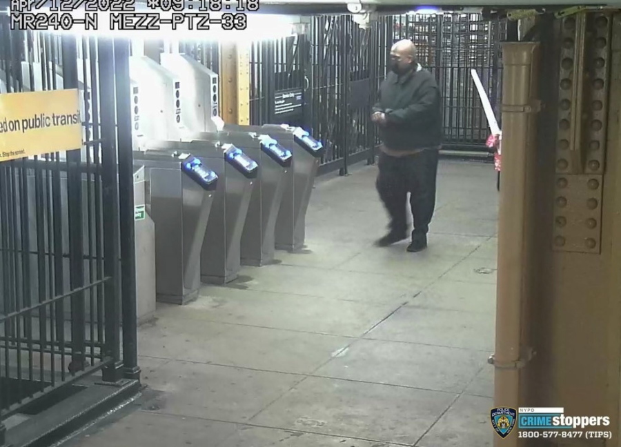 This image provided by New York Police Department on Wednesday, April 13, 2022, shows suspected subway shooter Frank R. James, 62, leaving a subway station after his attack on a subway train Tuesday.