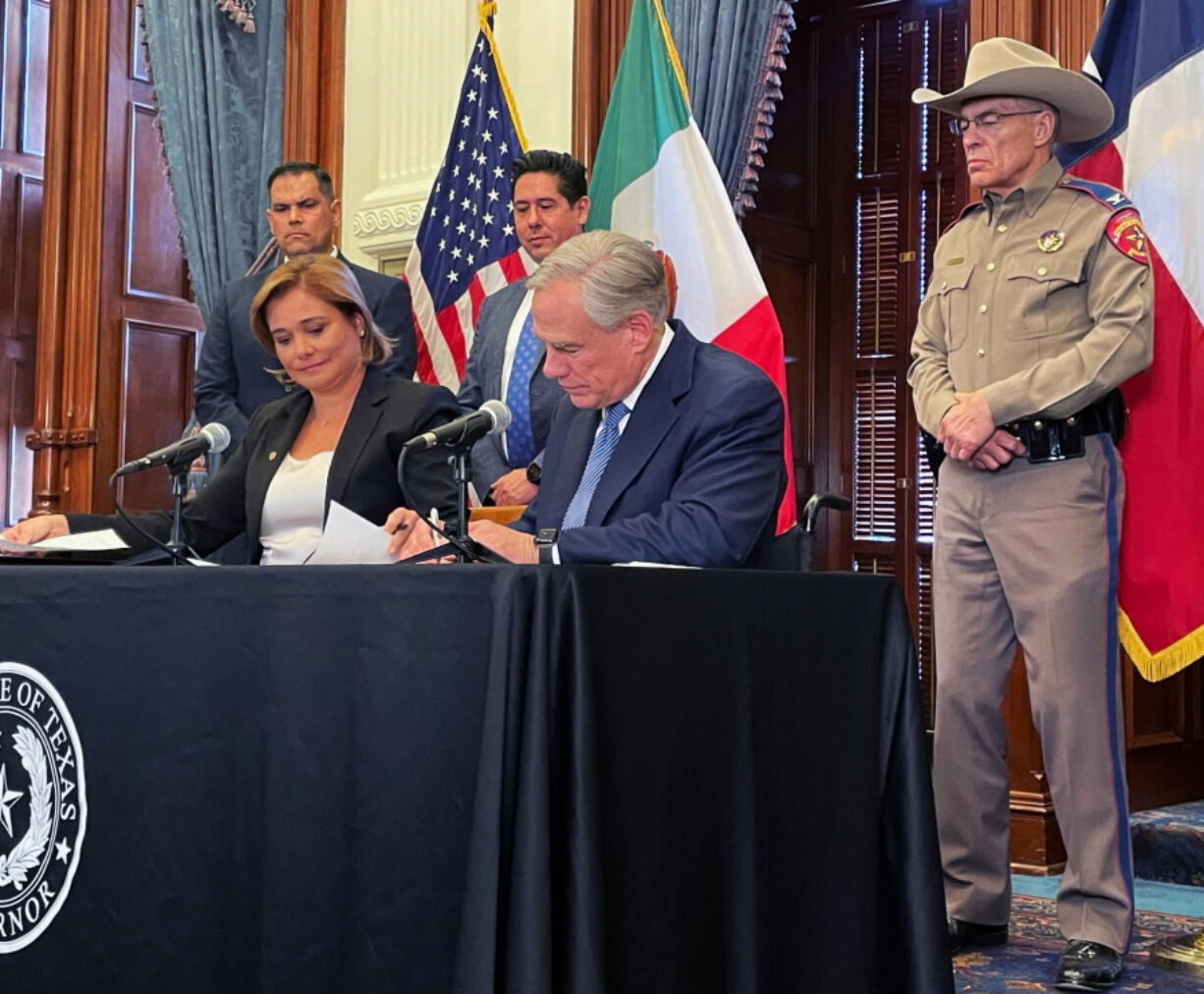 Texas Gov. Greg Abbott signs a border security agreement with Chihuahua Gov. Maru Campos Galvan in Austin, Texas on Thursday, April 14, 2022.
