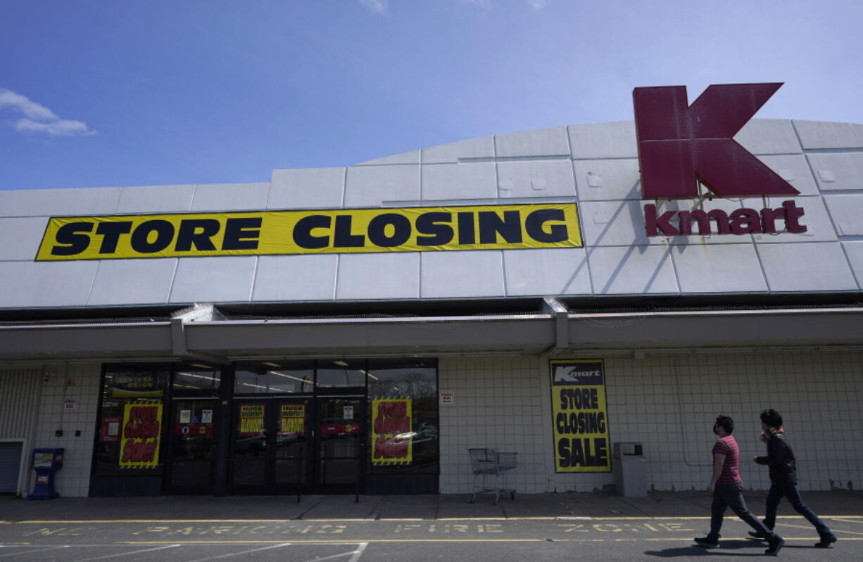 People walk into a Kmart in Avenel, N.J., on April 4, 2022. When the New Jersey store closes its doors on April 16, it will leave only three remaining U.S. locations for the former retail powerhouse.