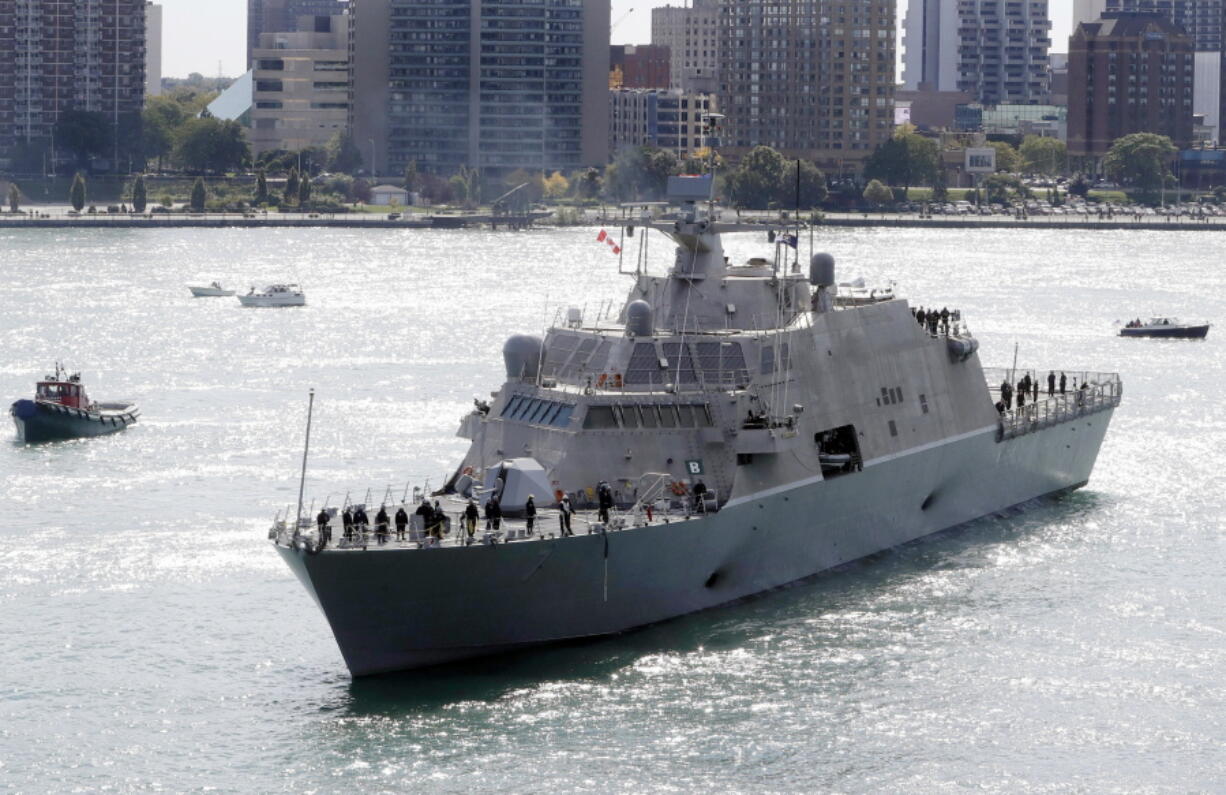 FILE - The USS Detroit, a Freedom-class of littoral combat ship, arrives Friday, Oct. 14, 2016, in Detroit. The Navy that once wanted smaller, speedy warships to chase down pirates has made a speedy pivot to Russia and China and many of those ships, like the USS Detroit, could be retired. The Navy wants to decommission nine ships in the Freedom-class, warships that cost about $4.5 billion to build.