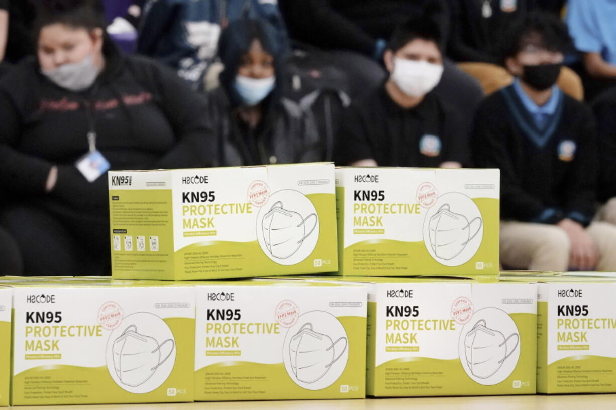 FILE - Boxes of KN95 protective masks are stacked together before being distributed to students at Camden High School in Camden, N.J., Wednesday, Feb. 9, 2022. According to a study by the Centers for Disease Control and Prevention released Tuesday, April 26, 2022,  three out of every four U.S. children have been infected with COVID-19.