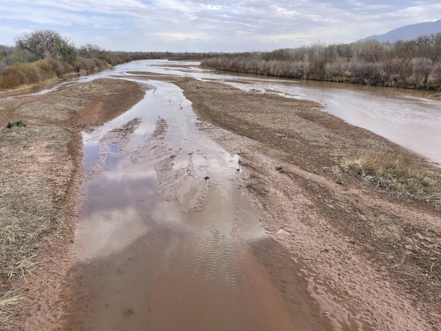 This April 10, 2022 image shows sand bars developing in the Rio Grande on the northern edge of Albuquerque, N.M. Irrigation districts from the Pacific Northwest to the Colorado River Basin already are warning farmers to expect less water this year despite growing demands fueled by ever-drying conditions.
