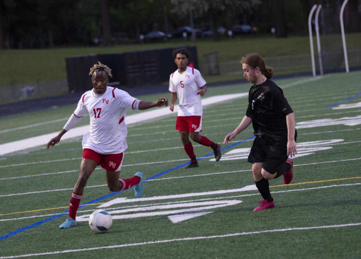 Fort Vancouver's Morlai Sesay (left) prepares to take the shot that gave the Trappers their lone goal in a 1-0 win over Hudson's Bay on Thursday, May 5, 2022.