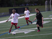 Fort Vancouver's Morlai Sesay (left) prepares to take the shot that gave the Trappers their lone goal in a 1-0 win over Hudson's Bay on Thursday, May 5, 2022.