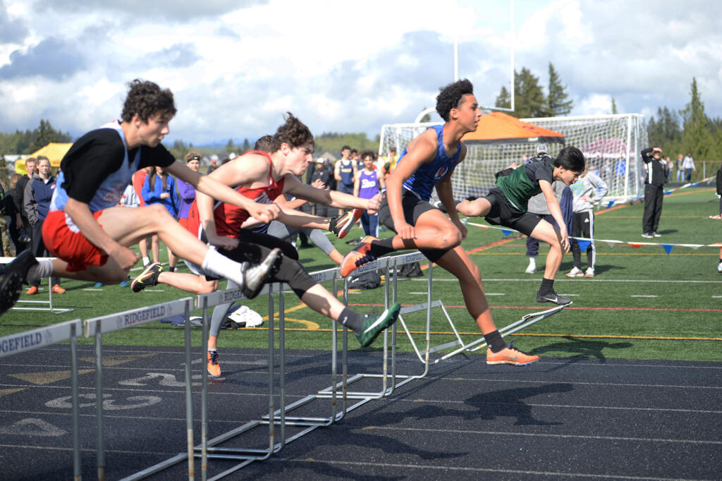 Ridgefield’s Landon Kelsey leads a flight of the boys 110-meter hurdles on Friday at the Spudder Invitational track and field meet at Ridgefield.
