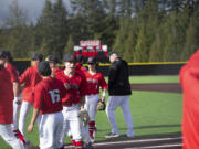 Drew Hancock celebrates with his teammates after the Camas Papermakers beat Sumner 9-3 in a 4A bi-district baseball game at Camas on Saturday, May 7, 2022.