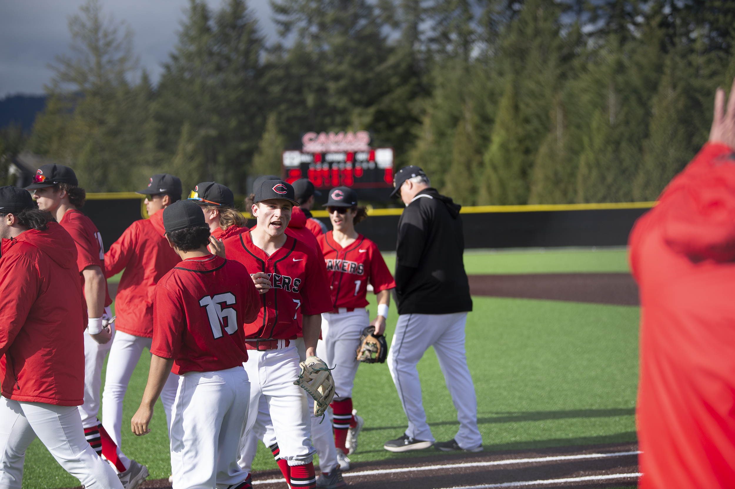 Drew Hancock celebrates with his teammates after the Camas Papermakers beat Sumner 9-3 in a 4A bi-district baseball game at Camas on Saturday, May 7, 2022.