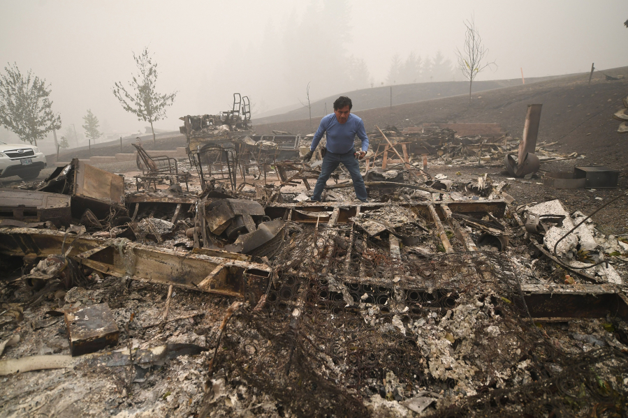 Marcelino Maceda looks for items in the remains of his mobile home after a wildfire destroyed multiple homes in Estacada, Oregon, on September 2020. With climate change causing more frequent and intense wildfires, people who rely on wells for drinking water are at particular risk.