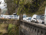 Cars snake along the Historic Columbia River Highway along the waterfall corridor in the Columbia River Gorge. Congestion on busy days has been so bad the traffic impairs the ability of emergency vehicles to respond to accidents.