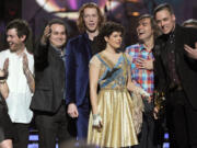 Arcade Fire accepts the Album of the Year Award for "The Suburbs" onstage during The 53rd Annual Grammy Awards on Feb. 13, 2011, in Los Angeles.