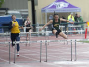 Evergreen's Grace Twiss clears a hurdle on her way to winning the 3A girls 300-meter hurdles at the 4A/3A District 4 track and field meet at McKenzie Stadium on Thursday, May 12, 2022.