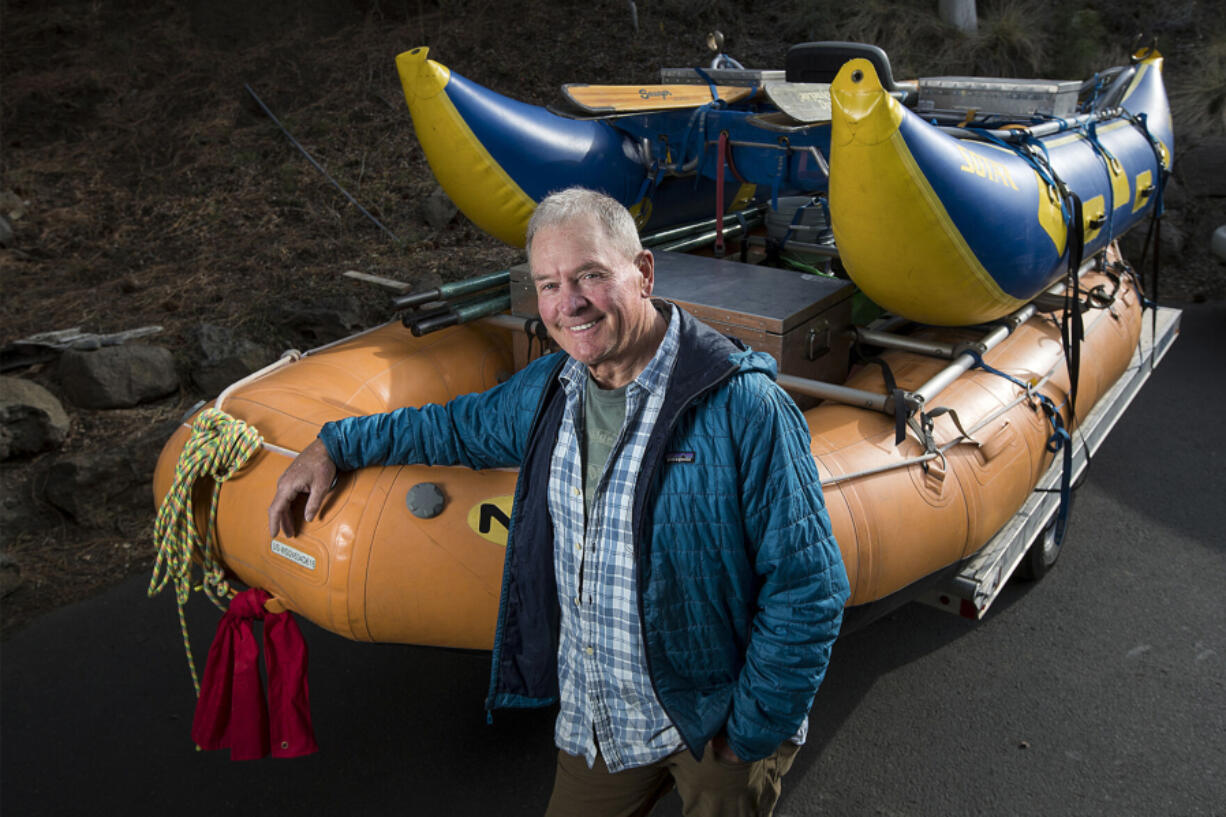 Peter Fox stands next to a pair of rafts in the driveway of his Bend, Ore., home.